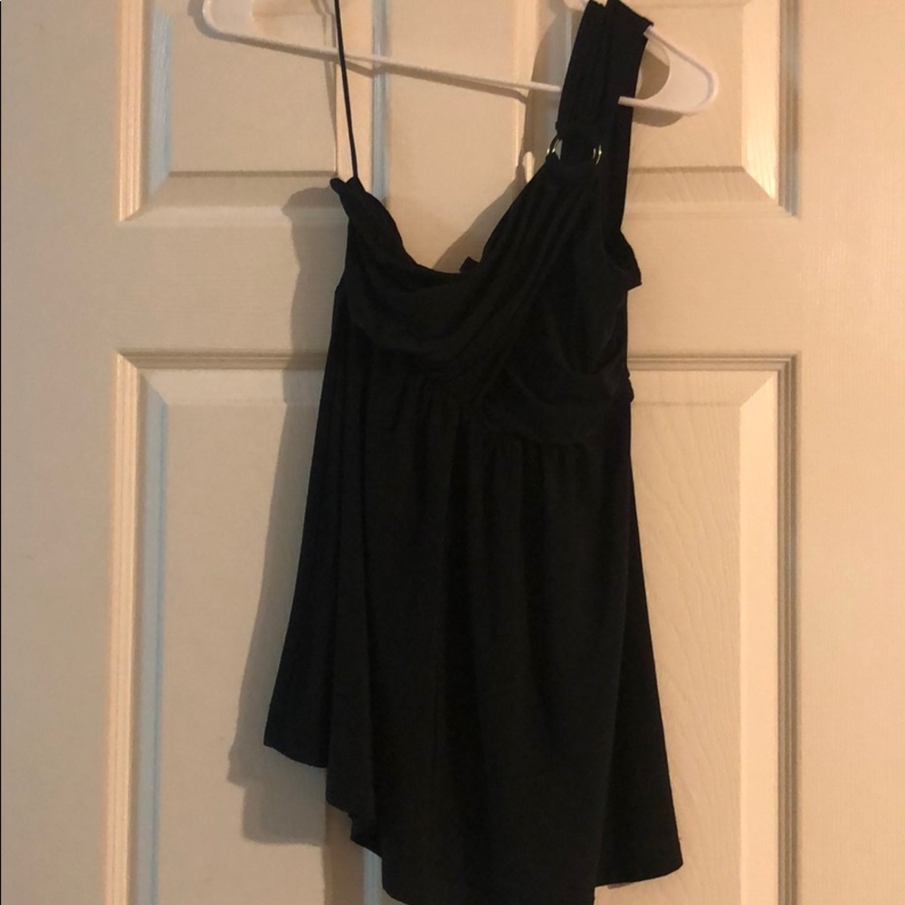 One shoulder off black top